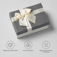 Boîte cadeau de luxe bicolore gris anthracite et blanc, avec nœud en satin crème, en carton rigide texturé lin, étui personnalisé pour boutique