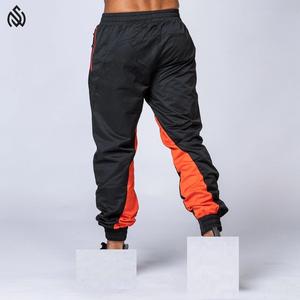 ชุดวอร์มเสื้อกันลมสำหรับผู้ชายกางเกงคาร์โก้ไนลอนแบบมีซิปน้ำหนักเบาชุดวอร์มกันลมออกแบบได้ตามต้องการ - Product Image 6