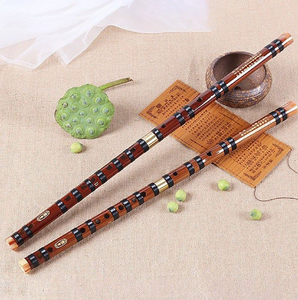This carved bamboo flute with pyrography detailing, a rustic <b>woodwind</b> <b>instrument</b> perfect for folk music, at wholesale prices. - Product Image 6