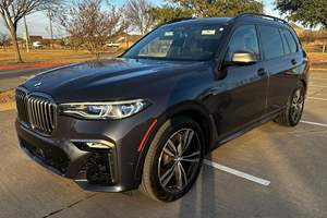 BMW X7 M50i 2020 d'occasion en bon état, 523 ch, V8 biturbo, transmission intégrale, configuration 6 places, non modifiée - Product Image 1