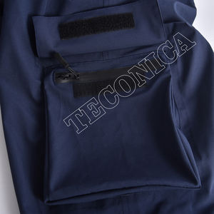 Pantalones de nieve impermeables clásicos azul marino con cintura elástica con trabillas para cinturón múltiples bolsillos de carga y salidas de aire - Product Image 4