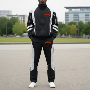 Chándales de poliéster para hombre, chaqueta y pantalón de nailon con cremallera de retazos, conjuntos de gimnasio para correr, bloque de Color personalizado, nailon OEM Unisex - Product Image 1