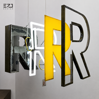Letras de Canal Iluminadas LED 3D Personalizadas EZD, Letrero con Logotipo de Cara Blanca y Borde Negro para Fachada de Tienda, Negocio, Pared Exterior
