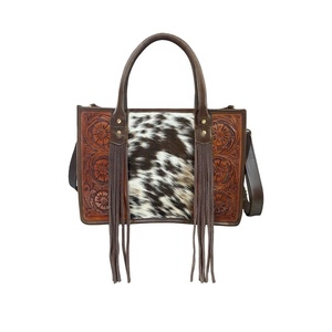 Unique High Quality Hair on Leather Floral Tooled <b>Tote</b> Bag Western Style Cowgirl Bag With Fringe Top Wholesaler Manufacturer - Product Image 1
