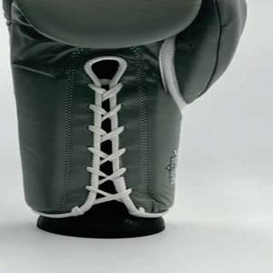 Guantes deportivos Unisex Ropa de entrenamiento Fabricación Cuero genuino Lucha profesional Logotipo personalizado Impreso Guantes de boxeo con cordones - Product Image 5