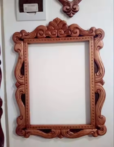 Marco de espejo de madera con detalles hechos a mano ideal para pasillo de baño o dormitorio estilo rústico de Azora Industries - Product Image 1