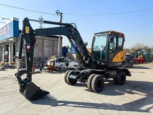 Mini-excavatrice sur pneus HW60 jaune, capacité de la benne de 0,21 m³, moteur et boîte de vitesses à haute puissance de creusement - Product Image 1