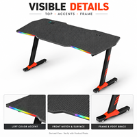 Bureau de jeu avec plateau noir sculpté et repose-pieds orange, surface en panneau E0 de 18 mm, fabriqué en Chine