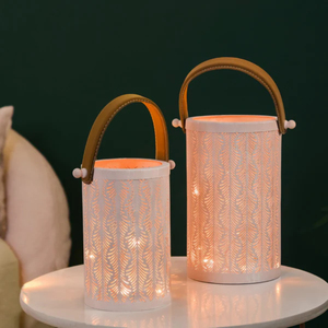 Set of Two <b>White</b> Metal Lanterns with Cutwork Design and Leather Handles Decorative Candle Holders for Home Decor Lighting - Product Image 1