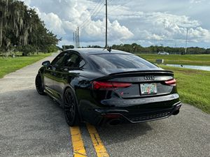 2021 ออดี้ อาร์เอส5 สปอร์ตแบ็ค รุ่นลอนช์ อิดิชั่น สีดำออปติก หลังคาซันรูฟแบบพาโนรามา เบาะหนัง เครื่องยนต์ทวินเทอร์โบ วี6 ล้อแม็กซ์ขนาด 20 นิ้ว เกียร์ 8 สปีด พวงมาลัยซ้าย ระบบขับเคลื่อนสี่ล้ออัตโนมัติ ระบบควบคุมความเร็วอัตโนมัติแบบแปรผัน ไฟ - Product Image 4