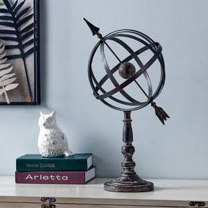 Solid brass armillary sphere with nautical compass accents great for collectors of vintage maritime themed decor pieces - Product Image 1
