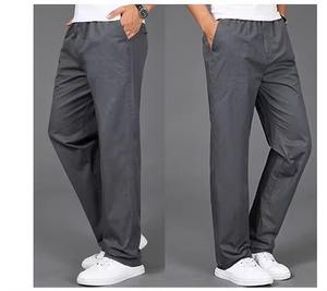 Pantalones informales de moda de calle alta para hombre, poliéster sólido, secado rápido, logotipo personalizado, multibolsillos, Parte delantera plana para ropa de trabajo deportiva - Product Image 1