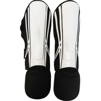 Protège-tibias de boxe en cuir PU de haute qualité, confortables, à prix direct usine, avec fermeture à lacets, pour entraînement MMA et Kick Boxing