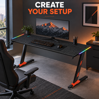 Bureau de jeu noir avec plateau rectangulaire côtelé et pieds orange pour bureaux à domicile, salles d'étude et salles de jeu