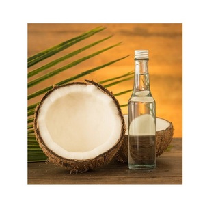 Usine en gros de qualité alimentaire 100% huile de noix de coco vierge pure pressée à froid en vrac pour l'alimentation et la routine de soins de la peau - Product Image 1