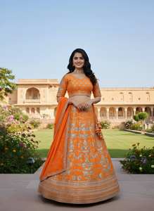 Resplandor en cada giro, esta vibrante lehenga naranja con intrincados bordados plateados es pura elegancia festiva. - Product Image 5