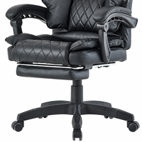 Chaise de bureau exécutive moderne en cuir PVC noir avec repose-pieds escamotable, dossier haut, accoudoirs rembourrés matelassés en losanges, idéale pour l'école