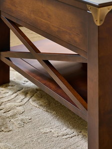 Mesa de centro de madera oscura con cajones y detalles en X - Product Image 3