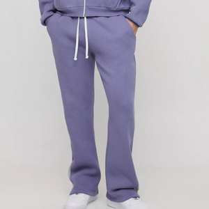 กางเกงกีฬาขายาวสำหรับผู้ชายกางเกงวิ่งผ้าฝ้าย100% เอวปรับได้สำหรับการฝึกออกกำลังกายในยิมและเครื่องแต่งกายแนวสตรีทสไตล์ลำลอง - Product Image 1