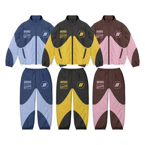 ชุดวอร์มแขนเสื้อสำหรับผู้ชายวัสดุไนล่อนกันลมสีเหลือง - Product Image 1