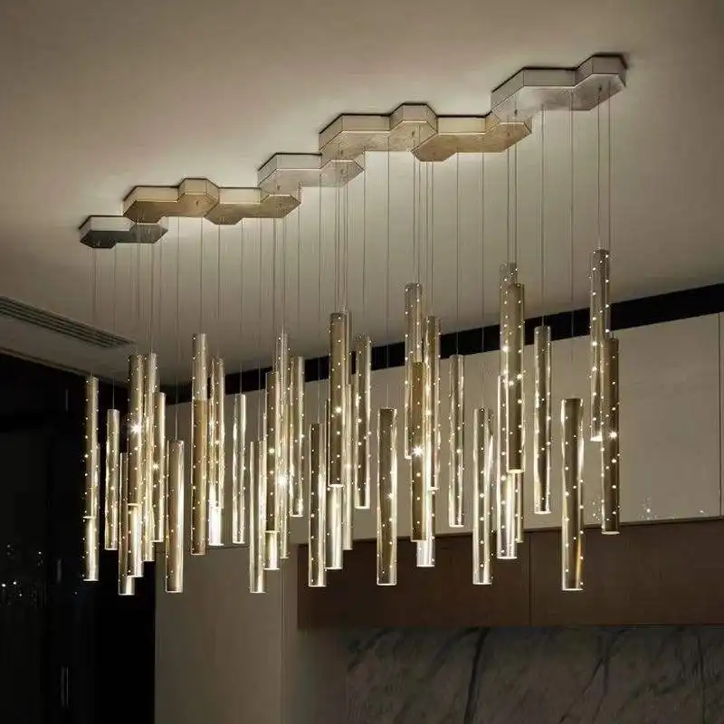 Lustre suspendu à flûte linéaire au design moderne Lustre décoratif à long tube rond en or pour carillon éolien de restaurant au design créatif