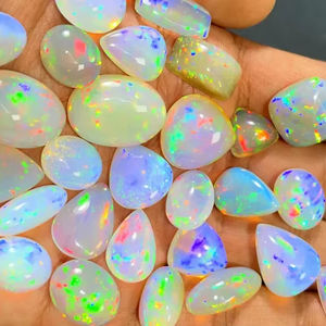 โอปอลไฟเอธิโอเปียแท้ทรงหลังเบี้ยสีขาว  โอปอลแท้รับรองคุณภาพ 5-8 กะรัต สำหรับทำเครื่องประดับ Mehradjuddin Gems - Product Image 2