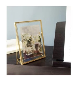 Stylish antique finished metal <b>photo</b> <b>frame</b> with <b>ornate</b> craftsmanship designed to enhance home interior aesthetics beautifully - Product Image 4
