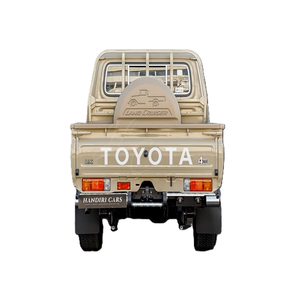 Toyota Land Cruiser Pickup LX 4WD Beige avec barres de toit métalliques et vue arrière - Product Image 1