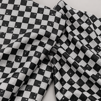 Tissu en maille à sequins géométriques noir et blanc avec motif à carreaux pour robes et décorations d'événements (vente en gros)