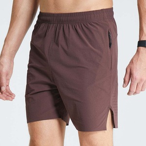 Pantalones cortos de gimnasio de algodón antiencogimiento con logotipo personalizado OEM, pantalones cortos de playa ajustados con bolsillos laterales grises para hombre - Product Image 1