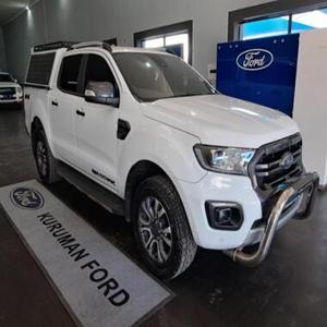 รถกระบะมือสอง Ford Ranger Wildtrak ปี 2024 เครื่องยนต์ 2.0 Bi-Turbo ขับเคลื่อน 4 ล้อ เกียร์ออโต้ แบบดับเบิ้ลแค็บ สีขาว ไฟหน้า LED ยาง R17 พร้อมแร็คหลังคาโลหะ ขาย - Product Image 1