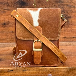 Bolso bandolera de piel de vaca de alta calidad al por mayor, bolso elegante con pelo en piel de vaca, bandolera de lujo con múltiples usos, bolso bohemio - Product Image 1