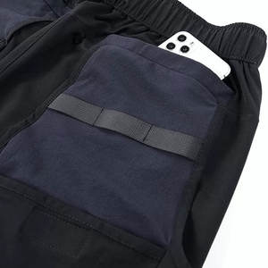 Pantalones cortos utilitarios modernos con funcionalidad multibolsillo y apariencia moderna Pantalones cortos utilitarios para hombres con tela duradera - Product Image 5