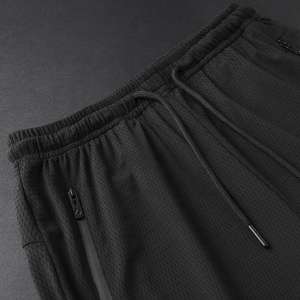 ชุดกีฬาผู้ชายผ้าฝ้ายเนื้อหนา ทรงหลวม สไตล์ลำลอง เอวกลาง กันน้ำ ระบายอากาศดี รับผลิตตามแบบ OEM พร้อมบริการสกรีนโลโก้สำหรับฤดูร้อนใหม่ - Product Image 5