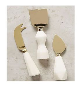 Ensembles de vaisselle décoratifs en métal faits à la main Vaisselle en acier inoxydable dorée Ensemble de fromage à poignée en résine blanche - Product Image 1