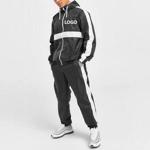 Conjunto Deportivo Personalizado para Hombre, Chaqueta Cortavientos con Paneles Blancos y Negros, Sudadera con Capucha, Ligero, Impermeable, para Correr - Product Image 1