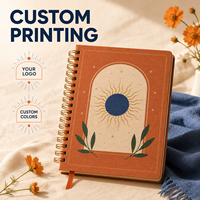 Carnet à spirale A5 personnalisé LABON, couverture en papier terre cuite, reliure spirale dorée, motif soleil, étoiles or et bleu marine, pages vierges, ruban