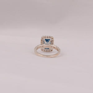 Fashionable Solitaire Blue Emerald Cut Lab Grown Diamond With Tiny Round Cut Diamond Halo Engagement Ring in 18KT <b>Solid</b> Gold - Product Image 4