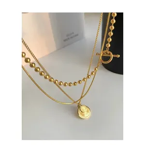 Collier superposé tendance en or 18 carats et titane avec perles rétro - Product Image 1