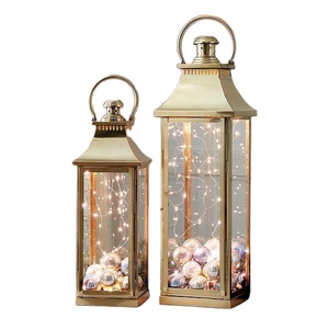 Linterna de vela de Metal decorativa con nuevo estilo con mango de Metal para relámpago decoración Exterior e Interior del hogar acabado dorado - Product Image 1