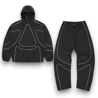 Chaqueta y pantalones de chándal de nailon a prueba de viento impermeables reflectantes de gran tamaño con cremallera de poliéster personalizados Conjunto unisex de chándal de nailon
