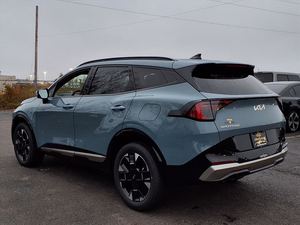 Kia Sportage hybride SX-Prestige AWD 2026 bleu éclatant, voiture d'occasion avec toit ouvrant, démarrage à distance, sièges en cuir, transmission automatique, jantes en alliage - Product Image 3