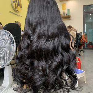 Precio de fábrica Extensiones de cabello humano Remy vietnamita ondulado Cabello de trama ondulado hinchable Cabello Remy de alta calidad - Product Image 1