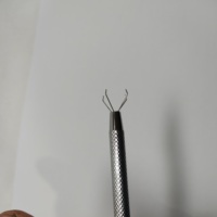 Pince à billes à 4 griffes en acier inoxydable étanche pour l'élimination et l'insertion de perles de piercing corporel