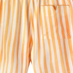 Maillot de bain jaune Striper conçu avec une poche latérale zippée en matériau élastique doux et polyvalent pour la plage ou les entraînements - Product Image 2