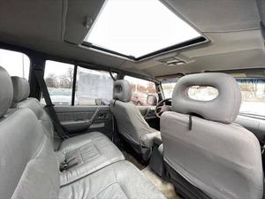 Mitsubishi Montero Base 4 portes 4x4 SUV R20 d'occasion de 1999, conduite à gauche, intérieur foncé, sièges en cuir - Product Image 6
