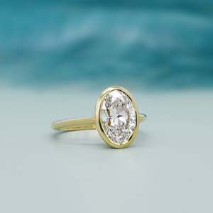 Oval Engagement <b>Ring</b> in Yellow Gold with Bezel Set <b>Diamond</b> Elegant <b>Diamond</b> <b>Rings</b> Collection - Product Image 2
