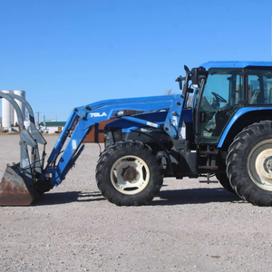 Tracteur HOL LAND TM125 d'occasion, modèle 1051, avec chargeur auto-nivelant 72LA, godet à fixation rapide de 96 pouces avec grappin - Product Image 1