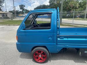 Honda Acty d'occasion, moteur turbo, pneus R15, sièges en cuir, couleur foncée, 100% en parfait état de marche, garantie sans accident. - Product Image 6