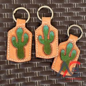 ห่วงโซ่กุญแจหนังที่แกะสลักด้วยมือรูปทรงแปลกใหม่น่ารักอุปกรณ์เสริมพวงกุญแจหนังสำหรับทุกเพศ - Product Image 1